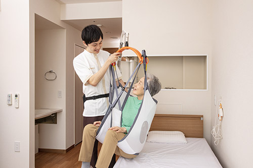A drop-down in-wall nursing care lift for in-room transfers Swing Lift CoCoRo